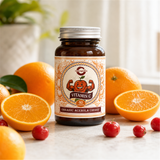 Vitamin C jar with fresh oranges and acerola cherries
